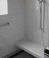 Installed after the rest of the shower had been completed, this tiled bench is supported by a lightweight aluminum frame; it required neither extra framing nor a waterproofing membrane.