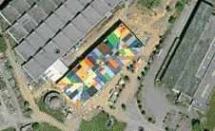 Was the architect also a quilter? Or did the owner of this French commercial building award the reroofing contract to a low bidder with a warehouse full of leftovers from previous jobs?
