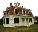 In designing this playhouse replica of the 140-year-old Penniman House (top), Mark Kinnane of Cape Associates balanced historical accuracy with user-friendly touches like window heights that allow children to look out from inside. To see other playhouses produced by the company, go to capeassociates.com.