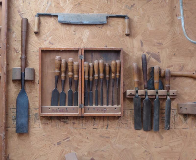 These tools once belonged to Marc Kunkel's great-grandfather, who was a barn builder. The oversize chisel on the left is a slick; it would have come in handy for timber-framing, the kind of construction once used to build barns.