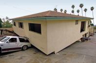 In an earthquake, shear walls help upper stories stay connected to the foundation, which moves rapidly back and forth. Without them, the movement gets too far out of sync, and the building “pancakes,” as in this 1994 photo from Northridge, Calif.