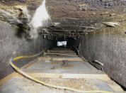 Panned bays are often leaky. In some cases, the air leaks are due to penetrations for wiring, piping, or ceiling strapping.