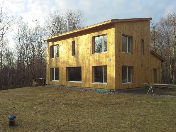 Chris Pike's house, built by Alex Carver (Northern Timbers Construction), near completion in fall 2013. This winter, says Pike, the house stays comfortable in below-zero weather with one or two firings of the wood stove per day.