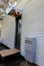 Rheem Tankless installed near the back door of this house.