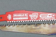 Both of these blades are Demo Demons; the lower one has made 126 cuts through nail-embedded wood. Although the carbide tips have been dulled, they remain intact and can still cut – though at a slower rate than when sharp.