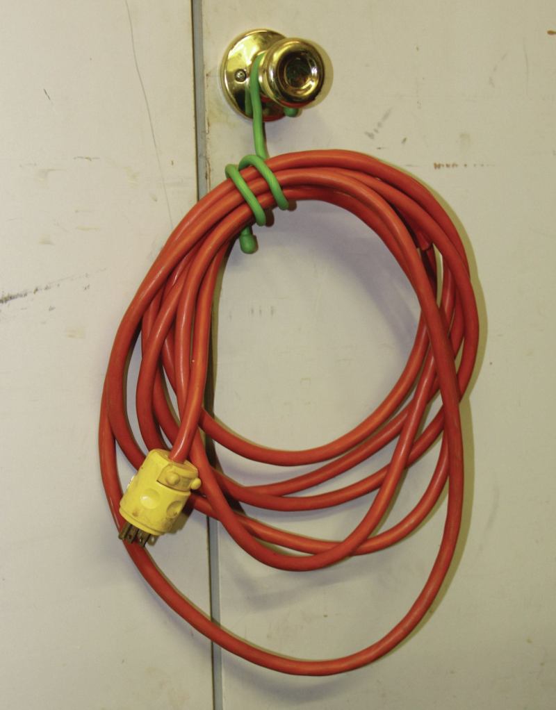 A 12-inch tie is coiled to secure a power cord.