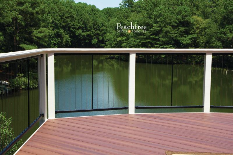 Fortress vertical stainless steel cable railing panels are shown on a deck built by Peachtree Decks and Porches, in Georgia.