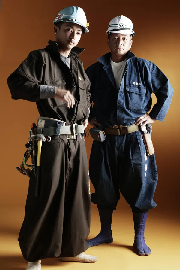 A photo from the catalog of the Kaseyama Co., a Japanese manufacturer of work wear, shows carpenters posing in tobi pants and jika-tabi boots. This style of work clothing is named for and popular with those trades that work high above the ground.