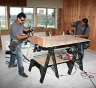 Multi-Function Slab bench top and shelf being used on site.