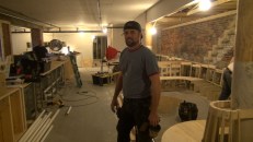 Nat Towl in the basement space under construction at 4 Free Street in Portland, Maine. To Towl's left will be 70 linear feet of lounge seating, with additional easy chairs and tables. To his right, the rough structure of a 40-seat Tiki bar is taking shape.