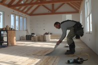 Interlocking radiant panels install easily over a wood subfloor. Once the panels are nailed down, PEX tubing is pressed into the grooves to deliver hydronic heat.