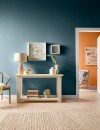 Here, Wanderlust is used on the wall of a living room