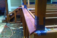 When a post sleeve will be used to cover the 4x4 post, flashing tape can be used to divert water away from the joint between the guard post and the deck framing and blocking.