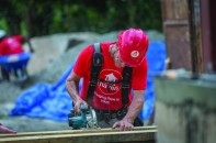 As part of a volunteer group, the author helps rebuild a school in Haiti.