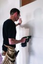 Preloaded screws, no cord. The author advocates the use of collated fasteners for their speed when you are initially hanging a sheet. He likes the convenience of cordless, as well as the added safety of not having a cord, which is a trip hazard around scaffolding and ladders.