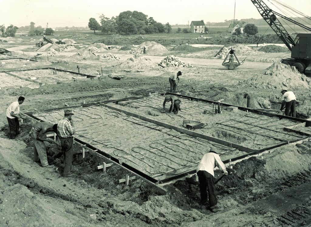 To increase production speed,  Levitt and Sons used slab-on- grade construction. At  the height of its productivity,  the company erected one  house every 16 minutes—  which became part of its  sales pitch. By 1951, 17,447  homes had been constructed.  No under-slab insulation  or vapor barriers were  installed, and the copper  piping used for the hydronic  radiant heat corroded fairly  quickly (leaks often went  unnoticed, soaking into the  ground). Many homeowners  abandoned their heating  system within 15 to 20 years.