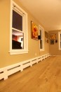 To cover the hydronic baseboard heating elements, these paint-grade covers were fashioned out of factory-primed 1-by pine.