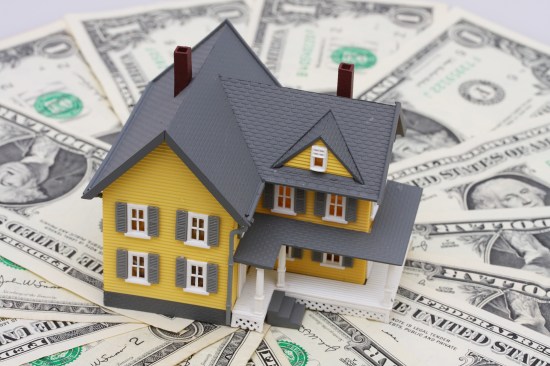 home surrounded by money
