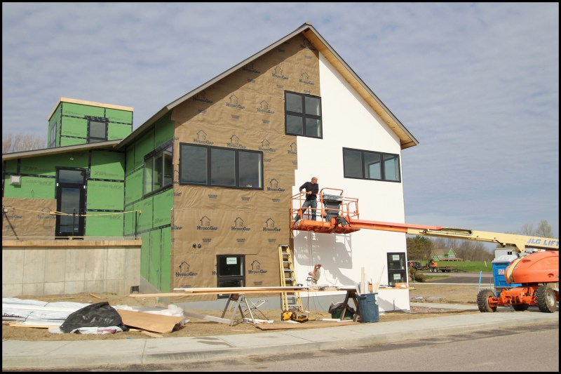 The library was built to be highly durable with 2x8-framed walls sheathed with 1/2-inch OSB and 2-inch Zip System R-Sheathing (with dense-pack cellulose). Wide windows reduced the number of long grade-to-soffit runs of vertical siding.