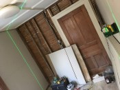 The DeWalt 360 hung on the wall is being used for drywall screw layout.