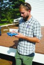 ReVision Energy’s Thomas Tutor demonstrates use of the Solmetric SunEye for determining solar exposure.