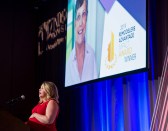 Kelly Kirk, president of Greymark Construction, accepts the Remodelers Advantage Impact Award for her mother, Leslie King, who passed away August 29, 2019.