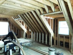 This occupied room over a garage included a substantial area of cathedral ceiling.