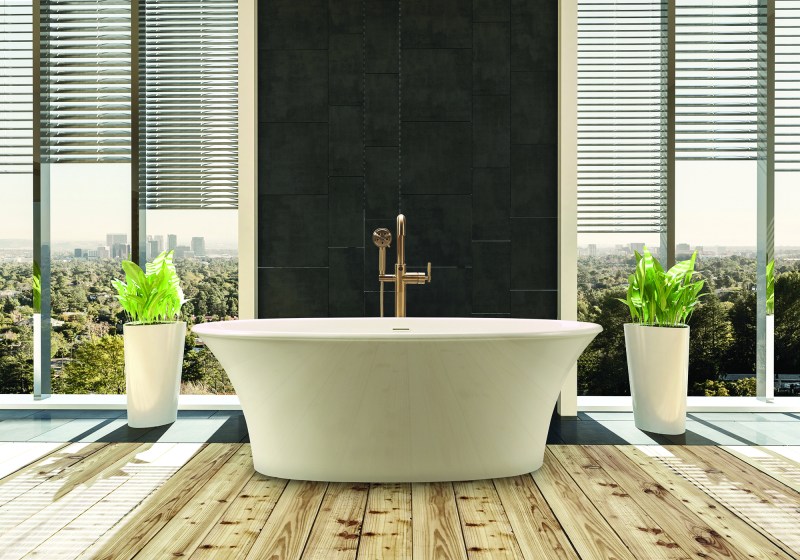 Elegant bathtub in modern bright bathroom with cityscape behind windows