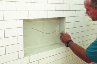 To waterproof a tiled niche, apply waterproof backerboard to the inside surfaces of the niche. (The back wall of this niche
was in two pieces to facilitate installation.)