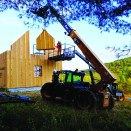 The crew sets straw panels on site in Leyden, Mass.