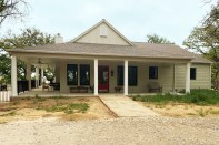 The Grandview ranch home’s traditional Farmhouse front elevation disguises a luxurious and elegant 4,000-square-foot, open-concept home.
