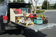 On his cargo slide, Richard Anderson created a shelf toward the cab end of his Toyota Tundra. He also built shelves along the inside of the truck over the tops of the wheel wells. The shelving houses tools, and the whole unit fits in the canopy opening. "When I pull my tools out, I can get to a row on top and on the bed itself," he says.