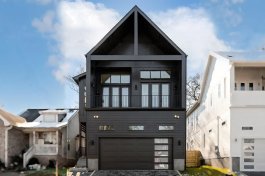 Modern house plan for a narrow lot, front exterior. See details at Houseplans.