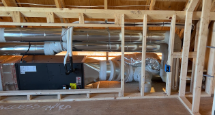 One of three Mitsubishi air handlers in the Queen of Zero home (AH2 serving the second floor as shown on the elevation below).