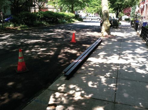 The W6x9 I-beams weighed 180 pounds each, so they weren't too heavy; the main issue was their length. We managed to move the beams inside through an existing street-side window.