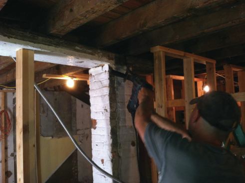 ... then started removing the dropped beam and the brick pier.