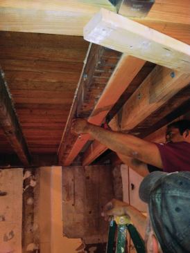 We infilled the stair opening with new double 2x6s sistered to the existing 3x6 joists with through-bolts. Where we needed to pick up point loads from above (avoiding posts and pilasters in the basement), we swapped out a few 2x6s for Microlams ...