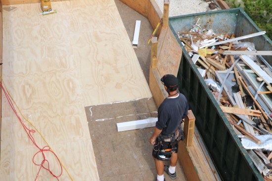 Before the fiberglass installation starts, a layer of 1/2-inc AC plywood is glued and nailed to the subfloor.
