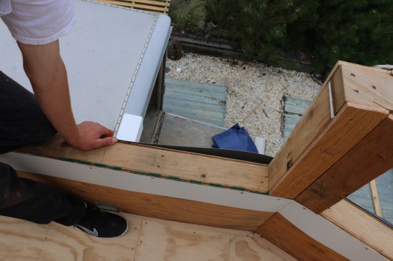 Roll flashing is installed on both sides of the top of the parapet walls. These will be integrated the fiberglass cloth and will help with water management.