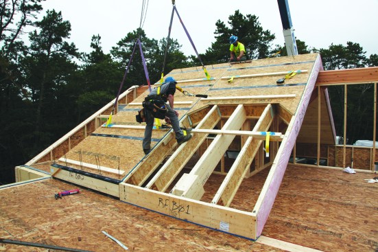 Roof panels have an integral lip that fits into a groove on the top of the bent beam.