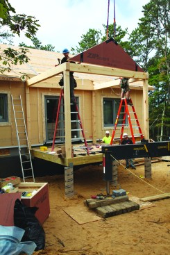 The main porch uses a timber frame to support the roof, but prebuilt gable panels sit on
the frame.