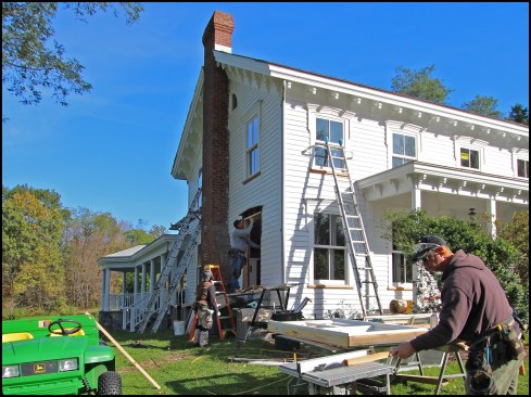 The author and his crew were familiar with working on this well-preserved home having built a two-story addition and covered porch on it a decade earlier (shown here behind the main house). Marvin Ultimate double-hung windows were installed in the addition, matching the new windows.