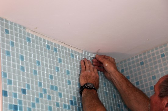 Don't try to cut too many mosaic tiles at once. Cutting tile for a ceiling strip, for instance, is best done a few tiles at a time.