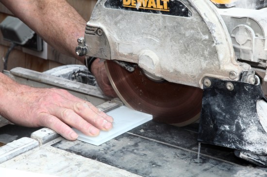 A wet saw equipped with a glass-cutting blade also does a great job.