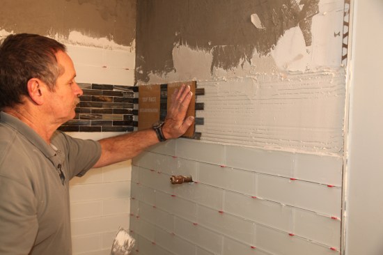 Press the band tile into place.