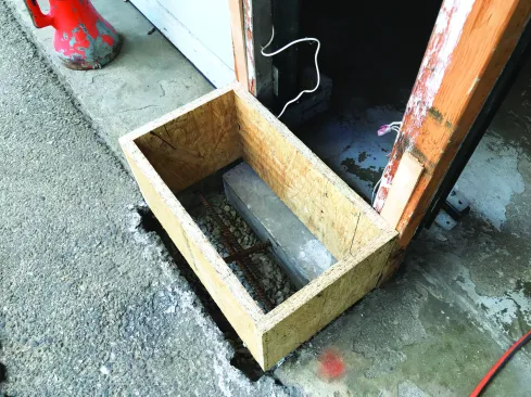 He epoxied rebar into the garage slab as well as the aprons.