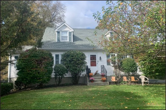 Originally, a masonry stoop with wrought-iron railings (typical of Capes in the Northeast) led up to the little-used main entry door, the focal point of the home’s prerenovation front façade.
