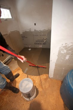 The author spreads the first batch with the gauge rake that he set to the deepest point of the leveler.