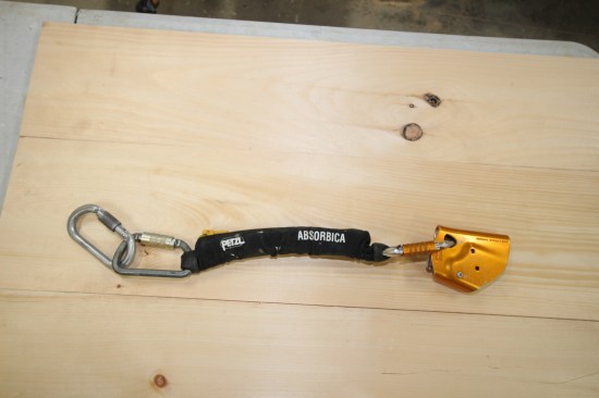 The Petzl ASAP device (gold device at the end) moves up and down the rope as the position of the worker changes.