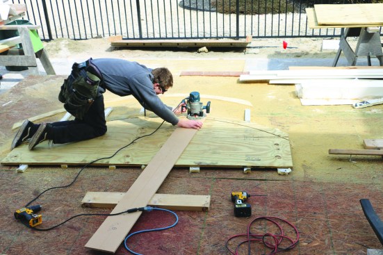 First, a crew member cuts the outside arc in two passes, and then he resets the pivot point to cut the inside arc to complete one of the plates.